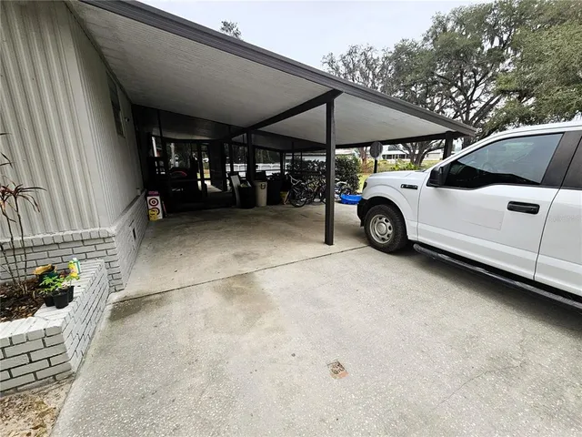a view of a car park in front of a house