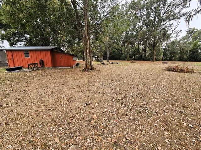 a backyard of a house with lots of green space