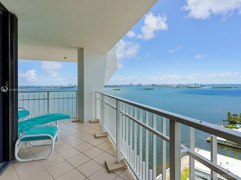 a view of a balcony with chair and table