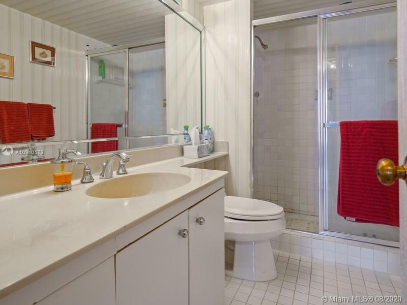 4000 Towerside Terrace, Unit 2302 Miami, FL 33138 - Photo 11 of 24 a bathroom with a sink toilet and shower