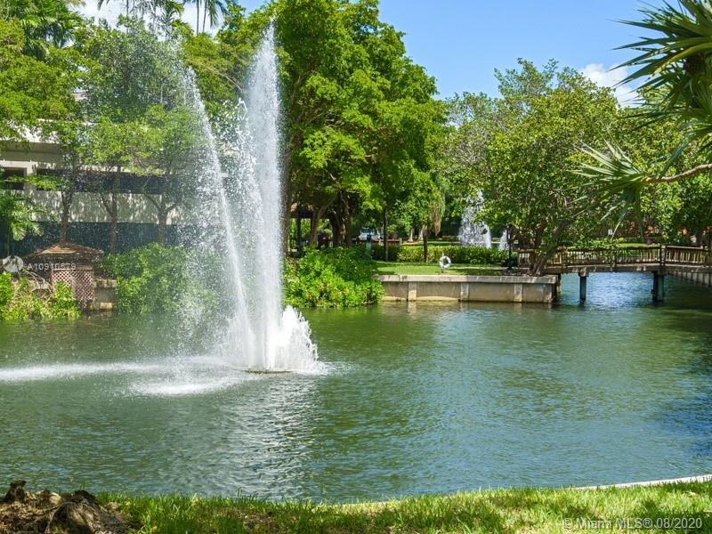 4000 Towerside Terrace, Unit 2302 Miami, FL 33138 - Photo 20 of 24 a view of a lake with a yard