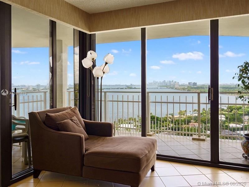 4000 Towerside Terrace, Unit 2302 Miami, FL 33138 - Photo 6 of 24 a living room with furniture and a floor to ceiling window
