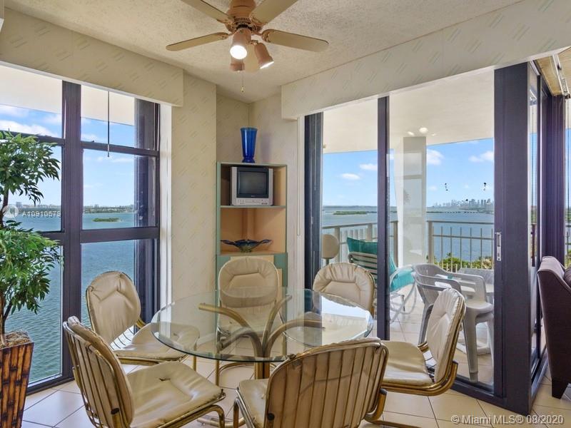 4000 Towerside Terrace, Unit 2302 Miami, FL 33138 - Photo 9 of 24 a living room with furniture and a floor to ceiling window