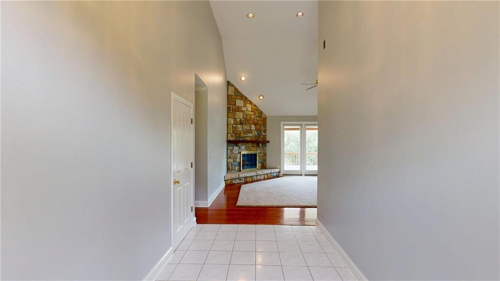 108 Oak Ridge Drive Venetia, PA 15367 - Photo 13 of 42 a hallway with wooden floor and a large window