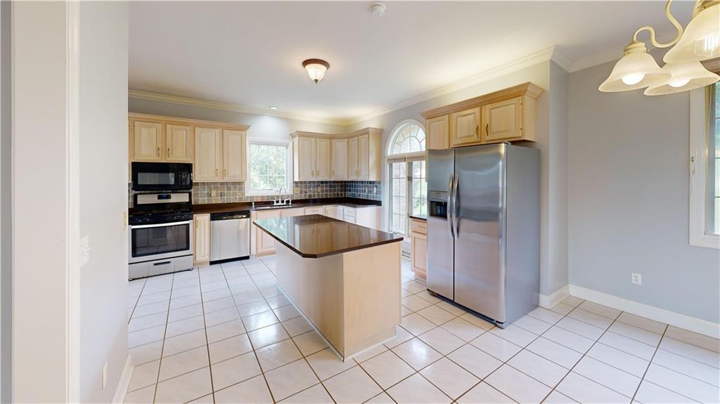 108 Oak Ridge Drive Venetia, PA 15367 - Photo 14 of 42 a kitchen with a sink a stove top oven and cabinets