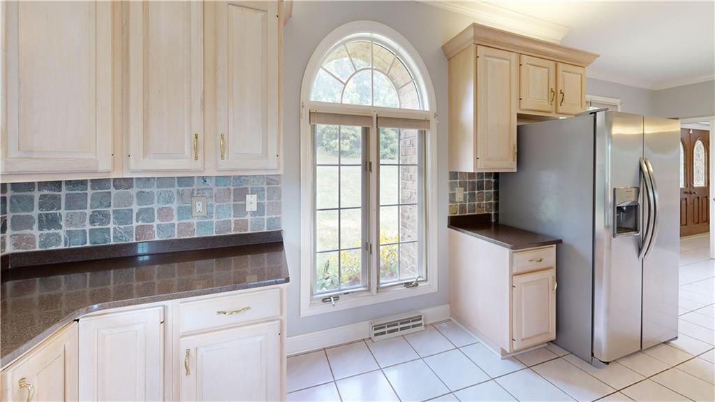 108 Oak Ridge Drive Venetia, PA 15367 - Photo 15 of 42 a kitchen with a refrigerator a sink and cabinets