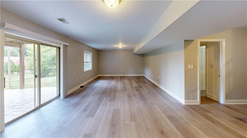 108 Oak Ridge Drive Venetia, PA 15367 - Photo 17 of 42 wooden floor in an empty room with a window
