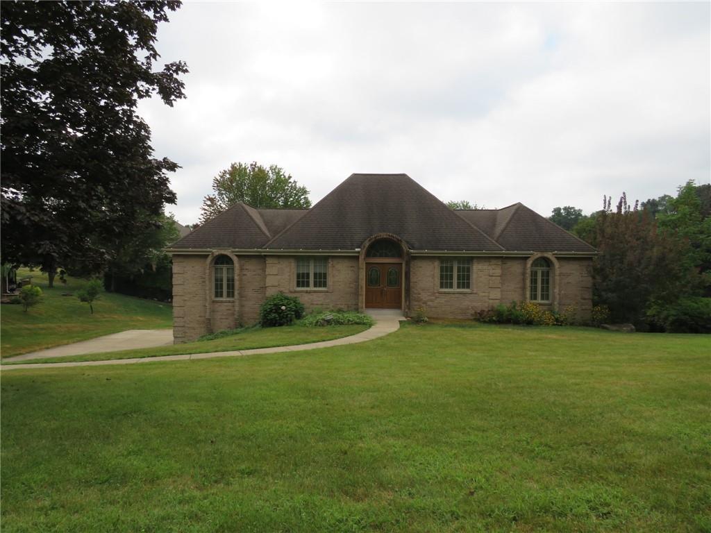 108 Oak Ridge Drive Venetia, PA 15367 - Photo 2 of 42 a front view of a house with a yard