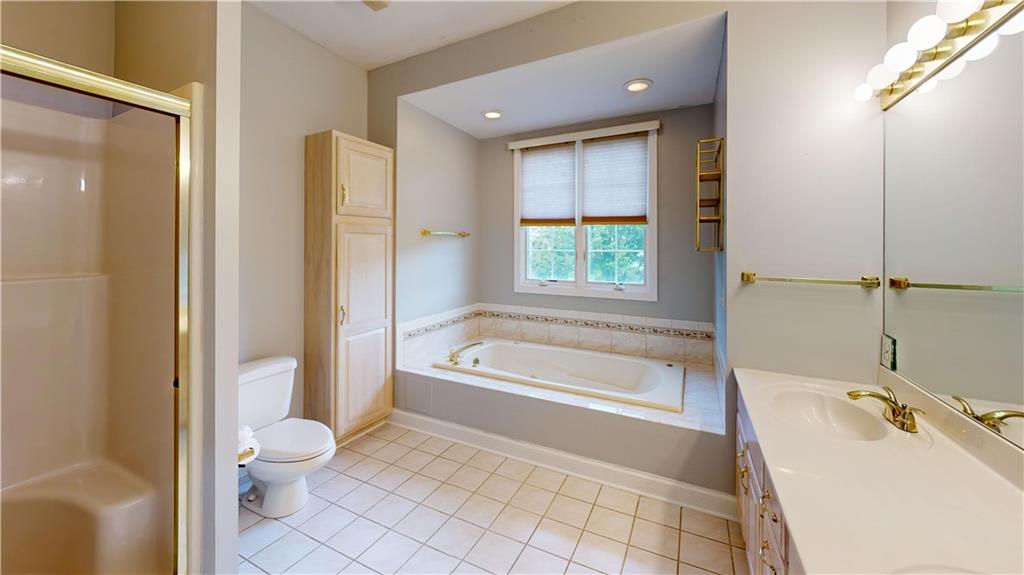 108 Oak Ridge Drive Venetia, PA 15367 - Photo 25 of 42 a bathroom with a tub sink toilet and a shower