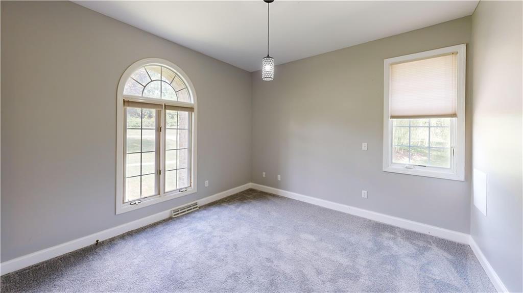 108 Oak Ridge Drive Venetia, PA 15367 - Photo 32 of 42 an empty room with windows and closet