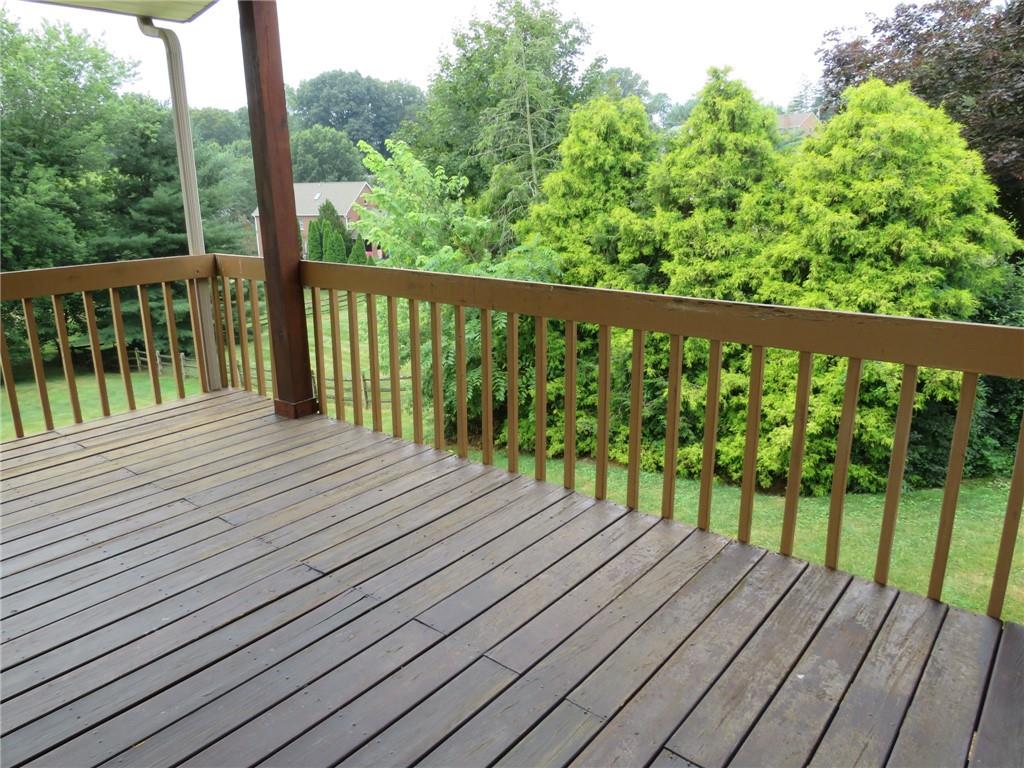 108 Oak Ridge Drive Venetia, PA 15367 - Photo 8 of 42 a balcony with wooden floor and fence