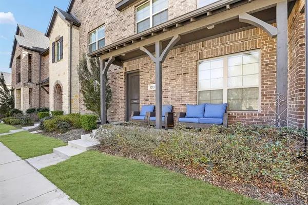 a house view with a seating space and garden space