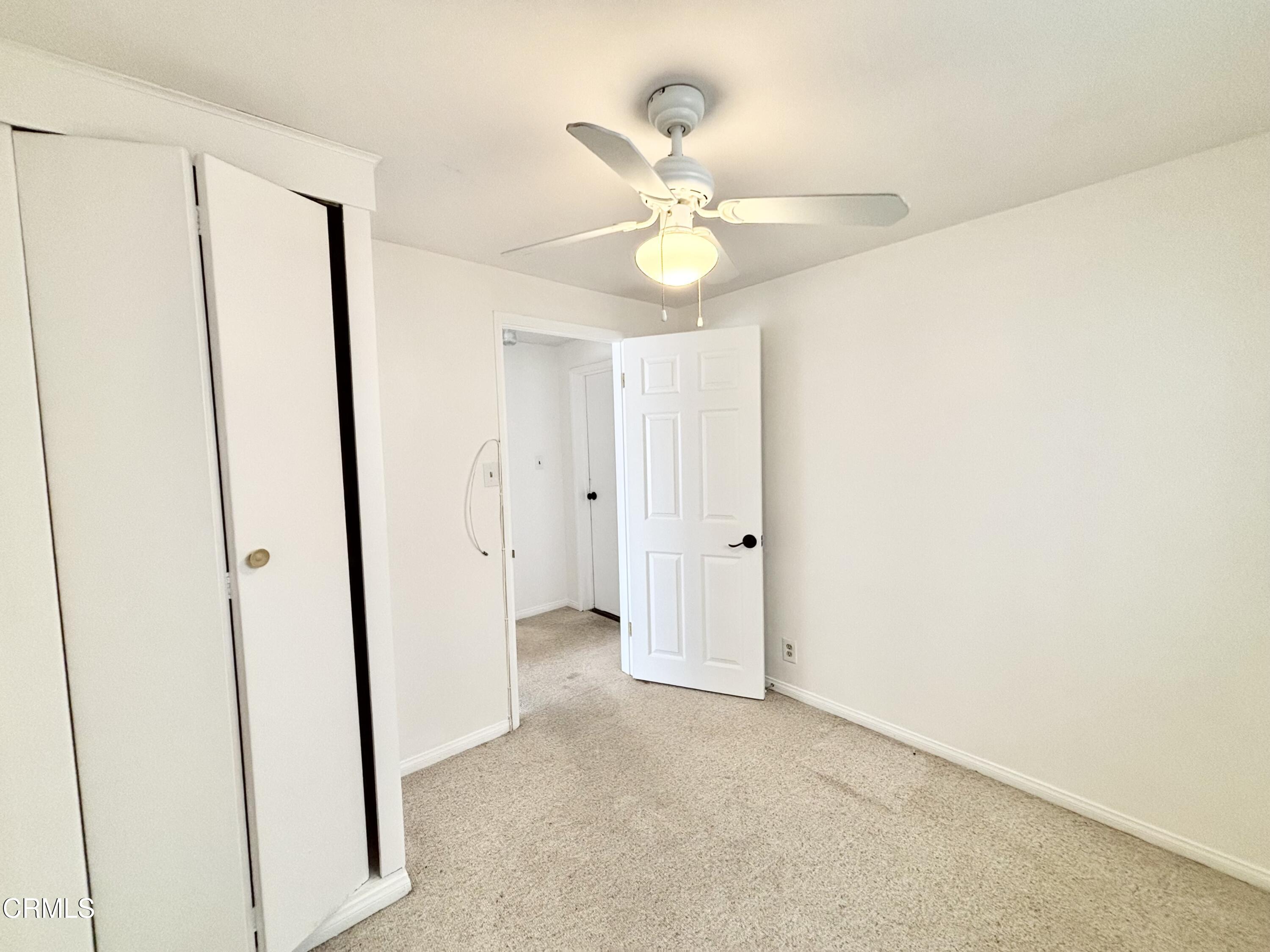 4029 Ocean Drive Oxnard, CA 93035 - Photo 16 of 20 a view of a chandelier fan and a closet