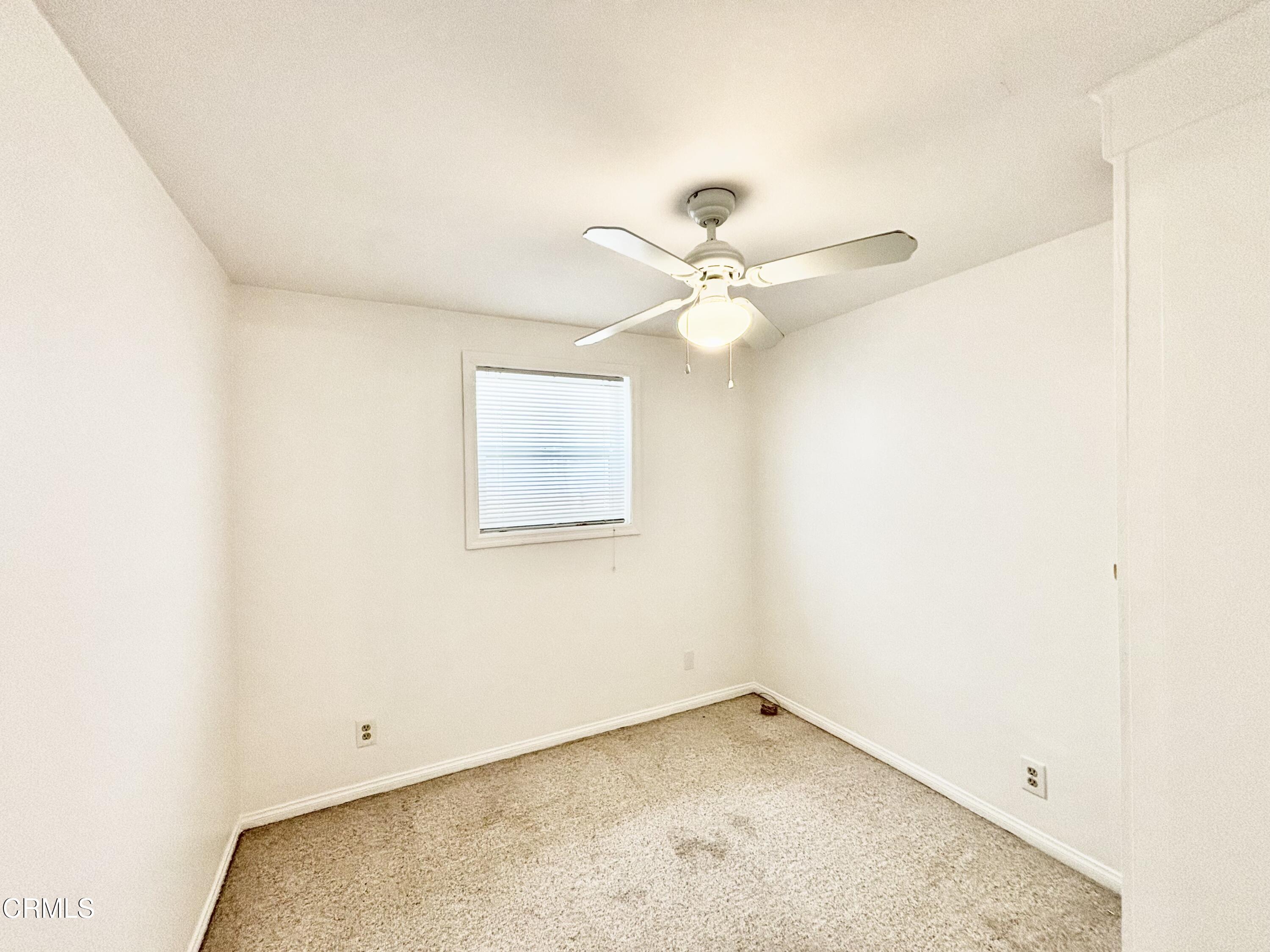 4029 Ocean Drive Oxnard, CA 93035 - Photo 5 of 20 an empty room with a window and ceiling fan