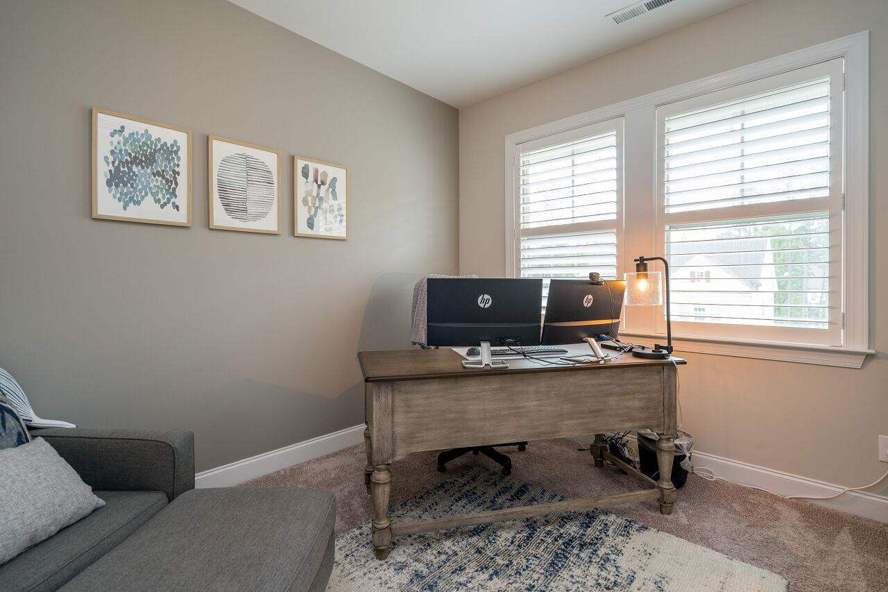 5268 Aleppo Lane Raleigh, NC 27613 - Photo 22 of 30 Second floor bedroom set up as a home office with beautiful light and shutters! Bedroom