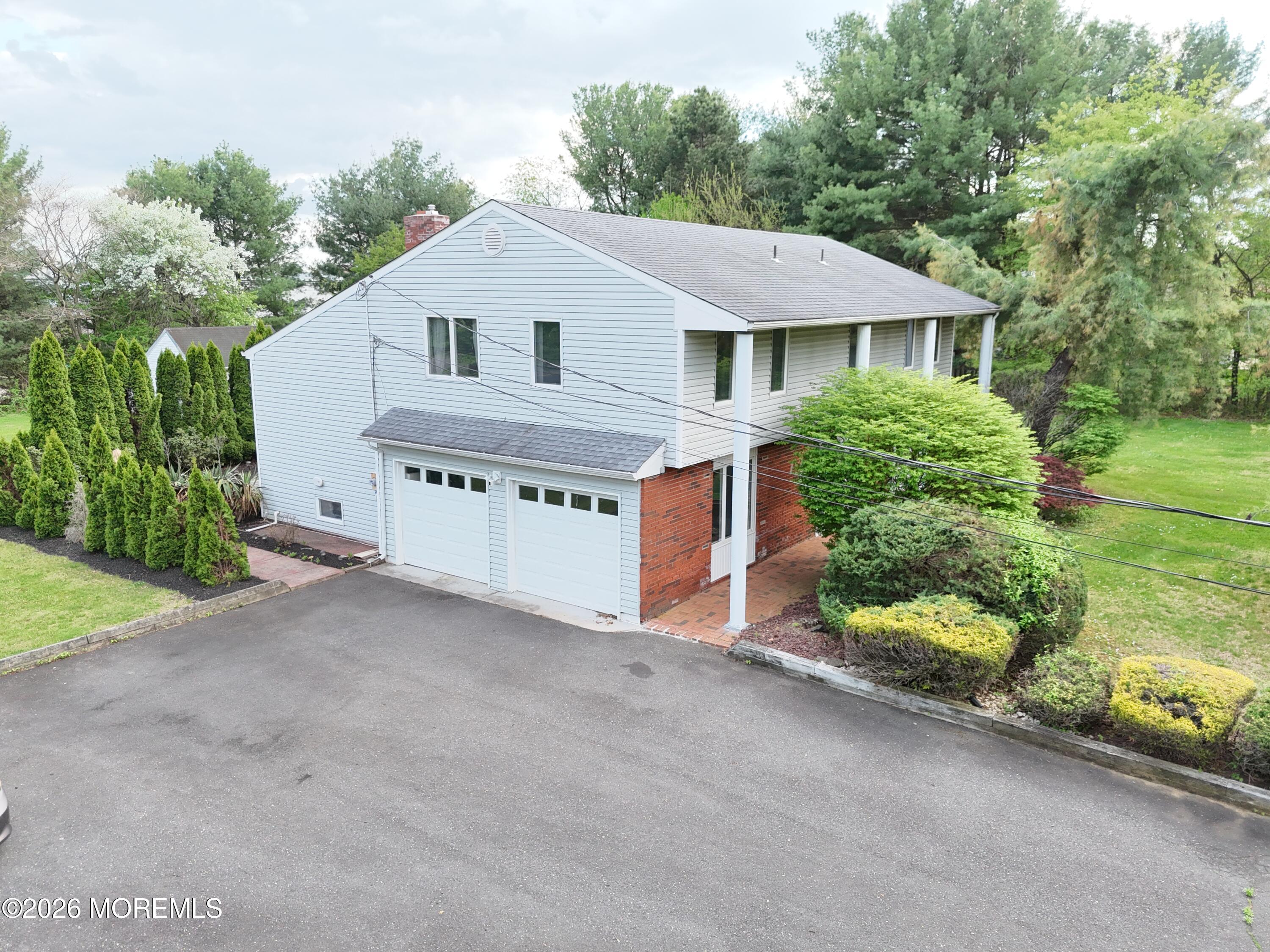 1 Flintlock Road Freehold, NJ 07728 - Photo 29 of 41 Left Side Garages