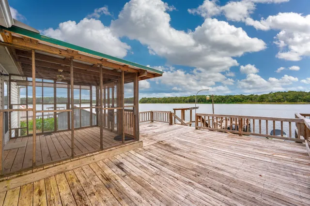 a view of balcony with wooden floor