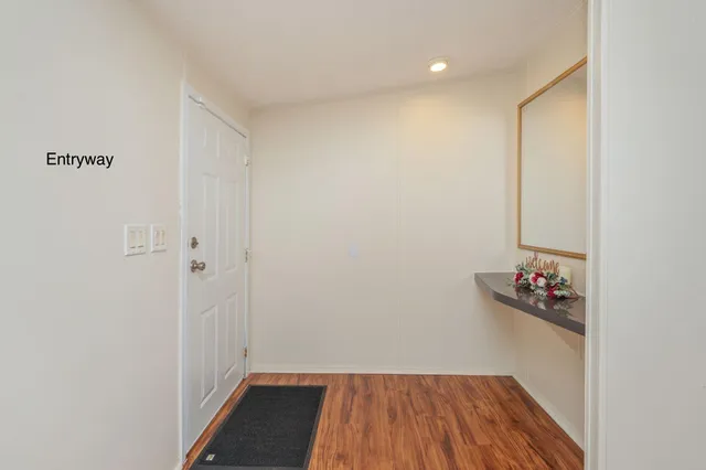 a view of room with wooden floor