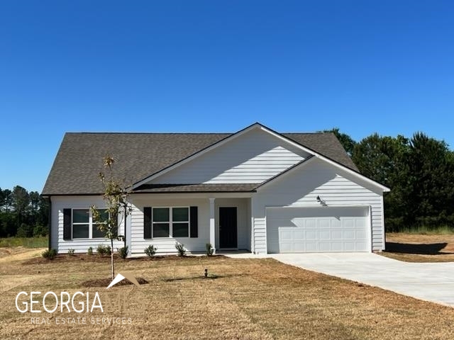 1289 Covered Bridge Road Covington, GA 30016 - Photo 1 of 1 a backyard of a house with seating space