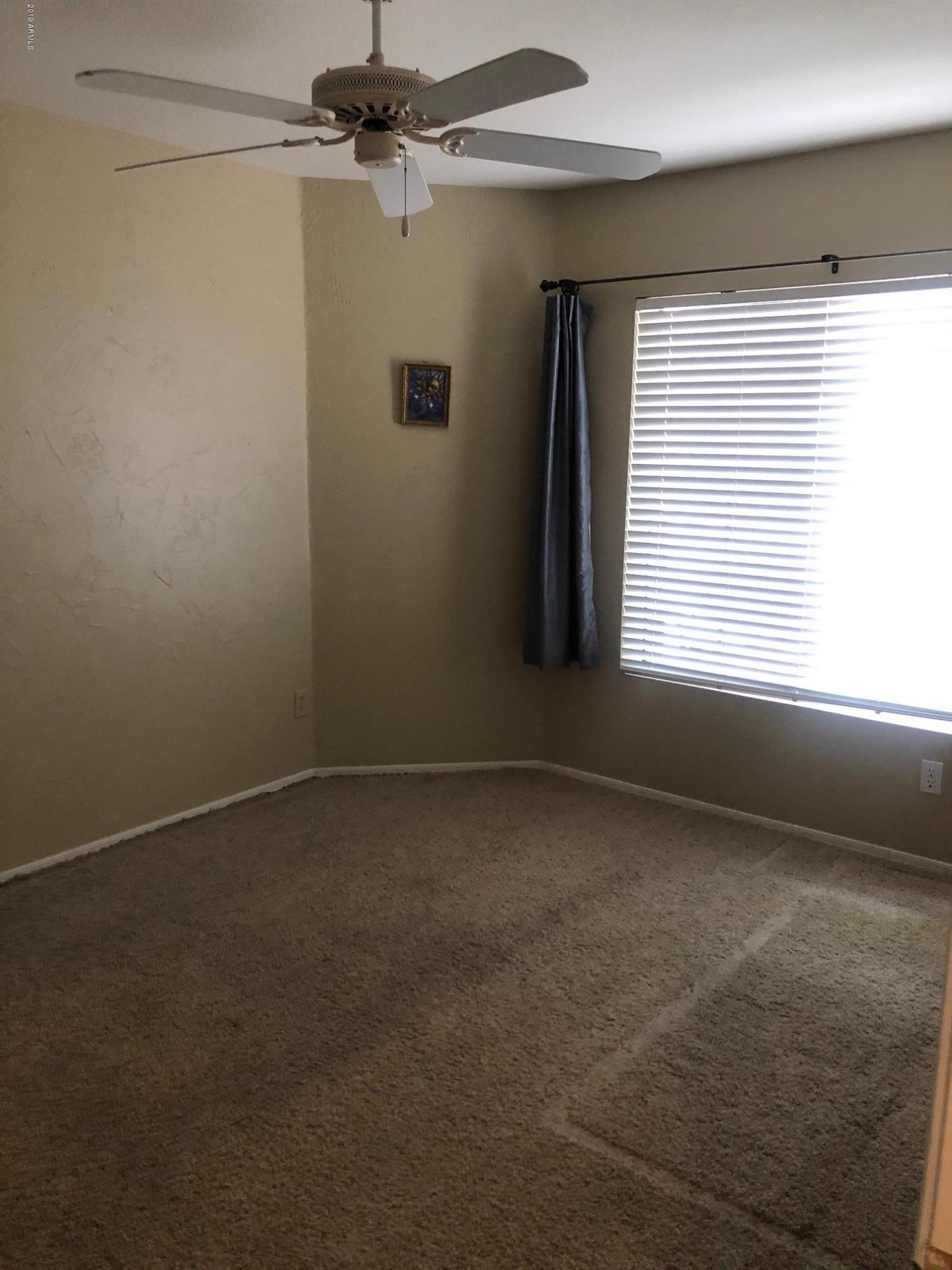 19022 North 24th Place Phoenix, AZ 85050 - Photo 12 of 20 a view of an empty room with a window