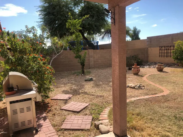 a view of a backyard of the house