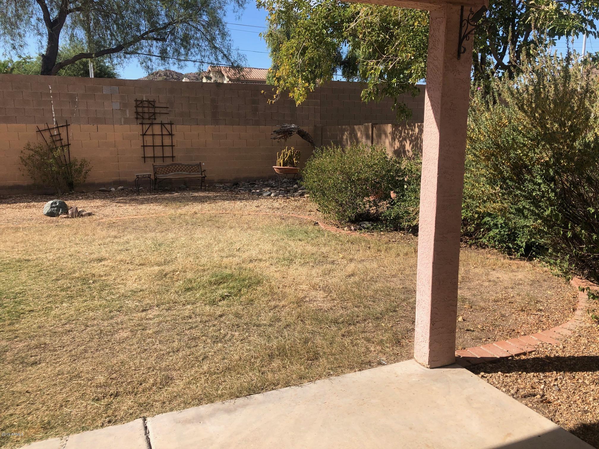 19022 North 24th Place Phoenix, AZ 85050 - Photo 18 of 20 a view of a backyard of the house