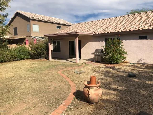 a view of a house with snow on the road