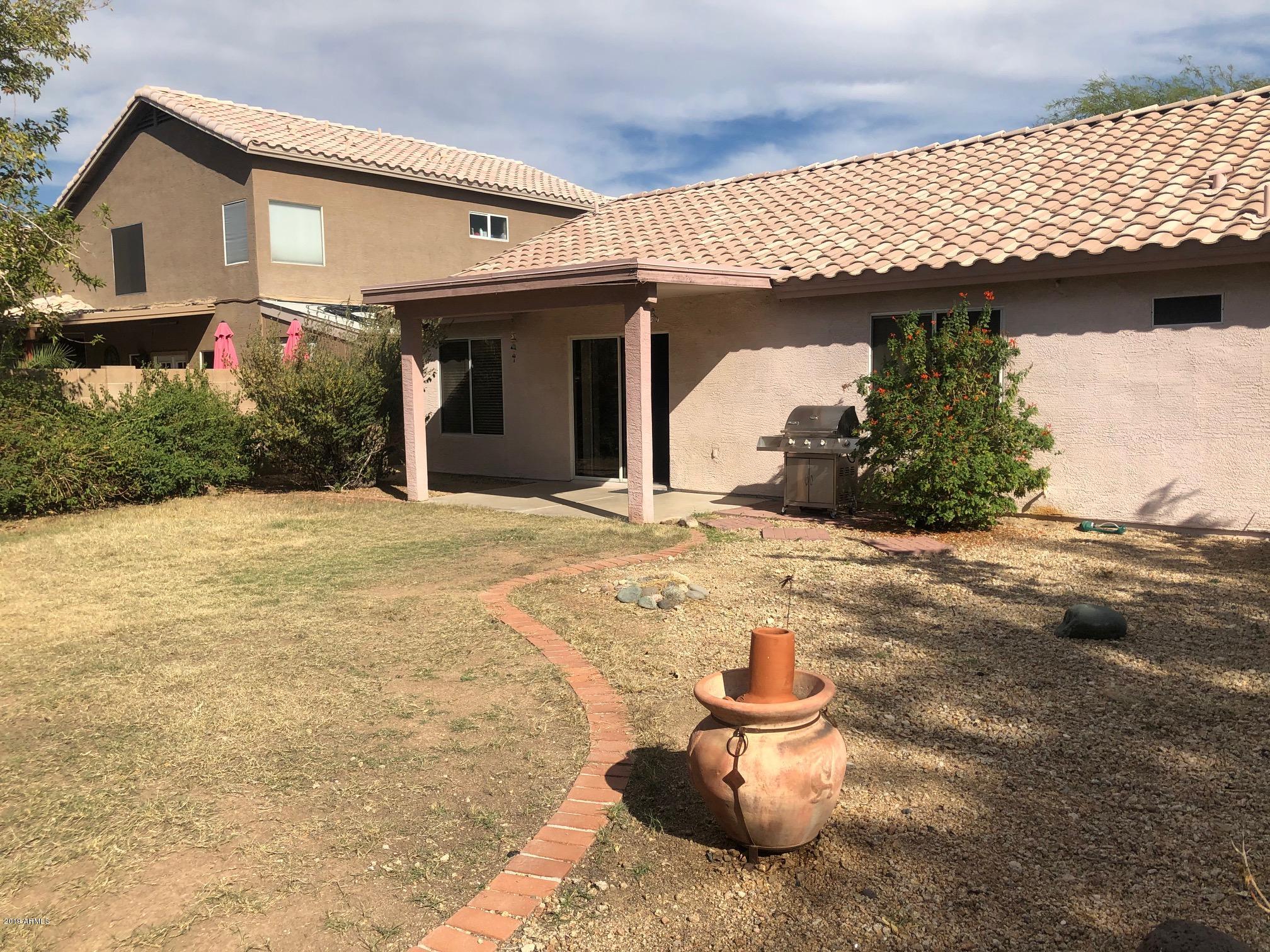 19022 North 24th Place Phoenix, AZ 85050 - Photo 19 of 20 a view of a house with a patio