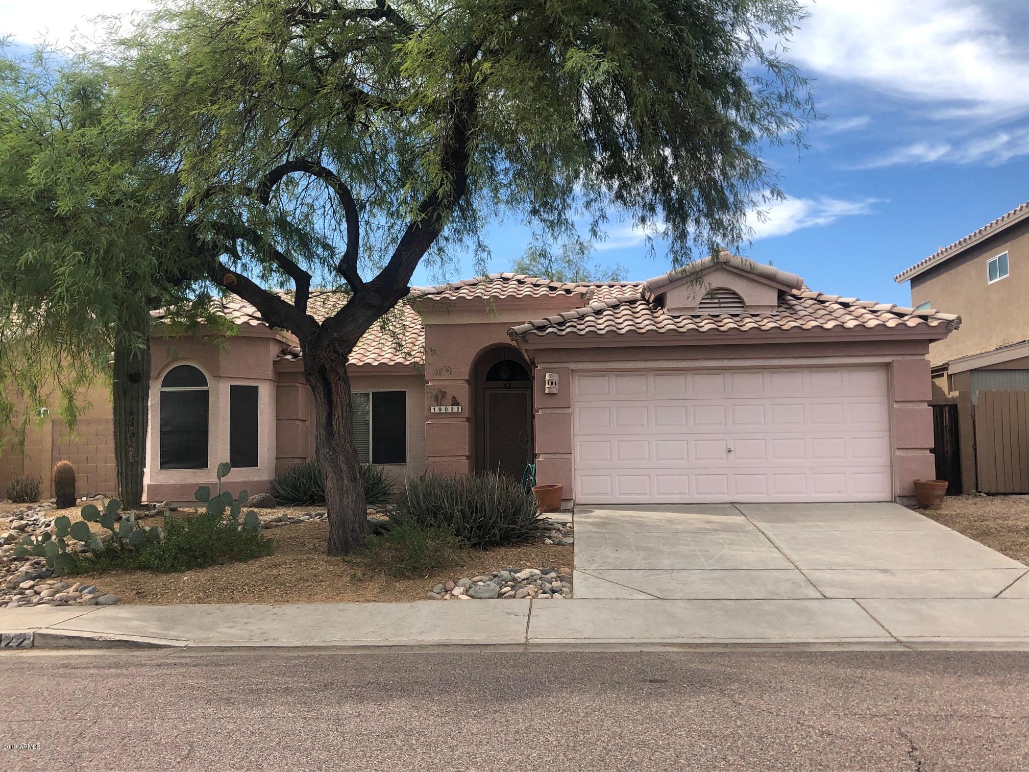 19022 North 24th Place Phoenix, AZ 85050 - Photo 2 of 20 a front view of a house with a garden