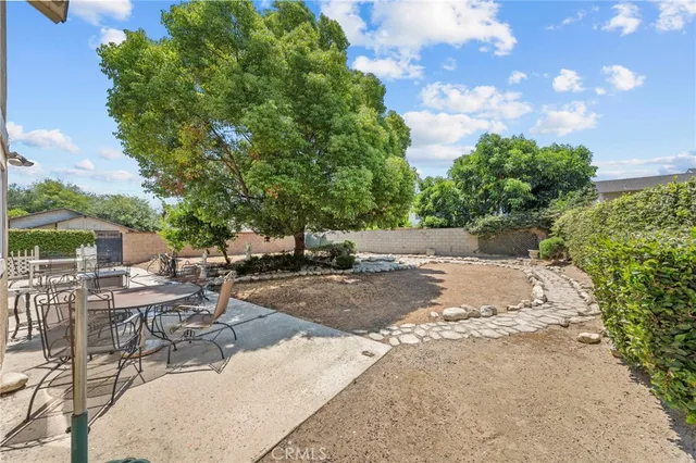 a view of backyard with patio