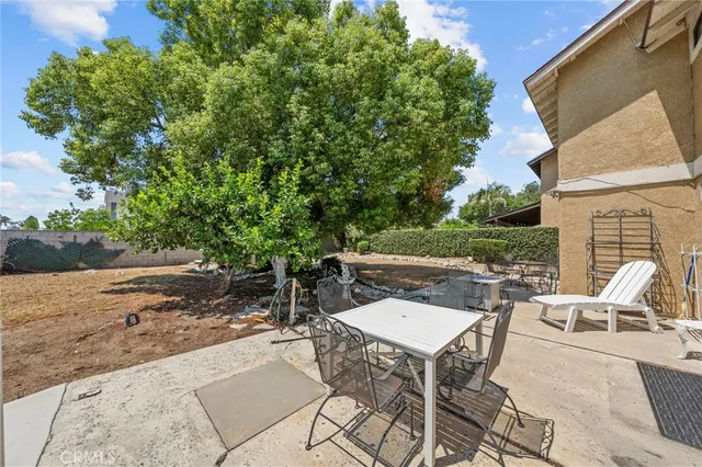 a view of backyard with seating space