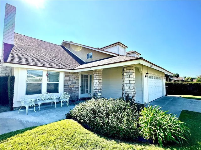 a front view of a house with garden