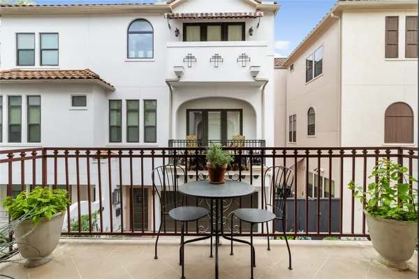 a view of a chair and table in the balcony