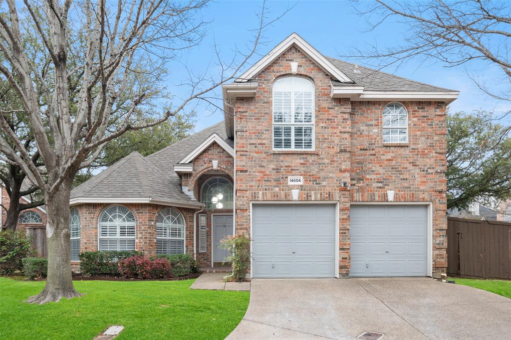 14604 Hemingway Court Addison, TX 75001 - Photo 2 of 27 a front view of a house with a garden and plants