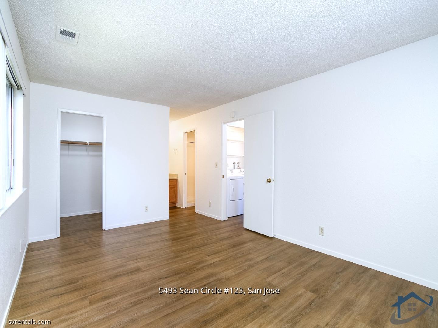 5493 Sean Circle, Unit 123 San Jose, CA 95123 - Photo 16 of 22 a view of an empty room with wooden floor and closet