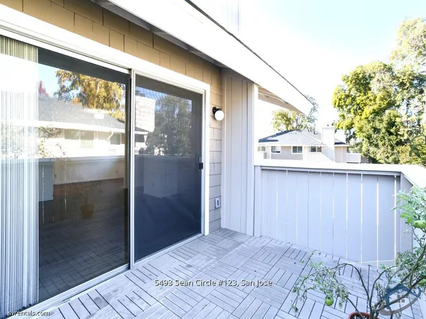 a view of a glass door with a yard