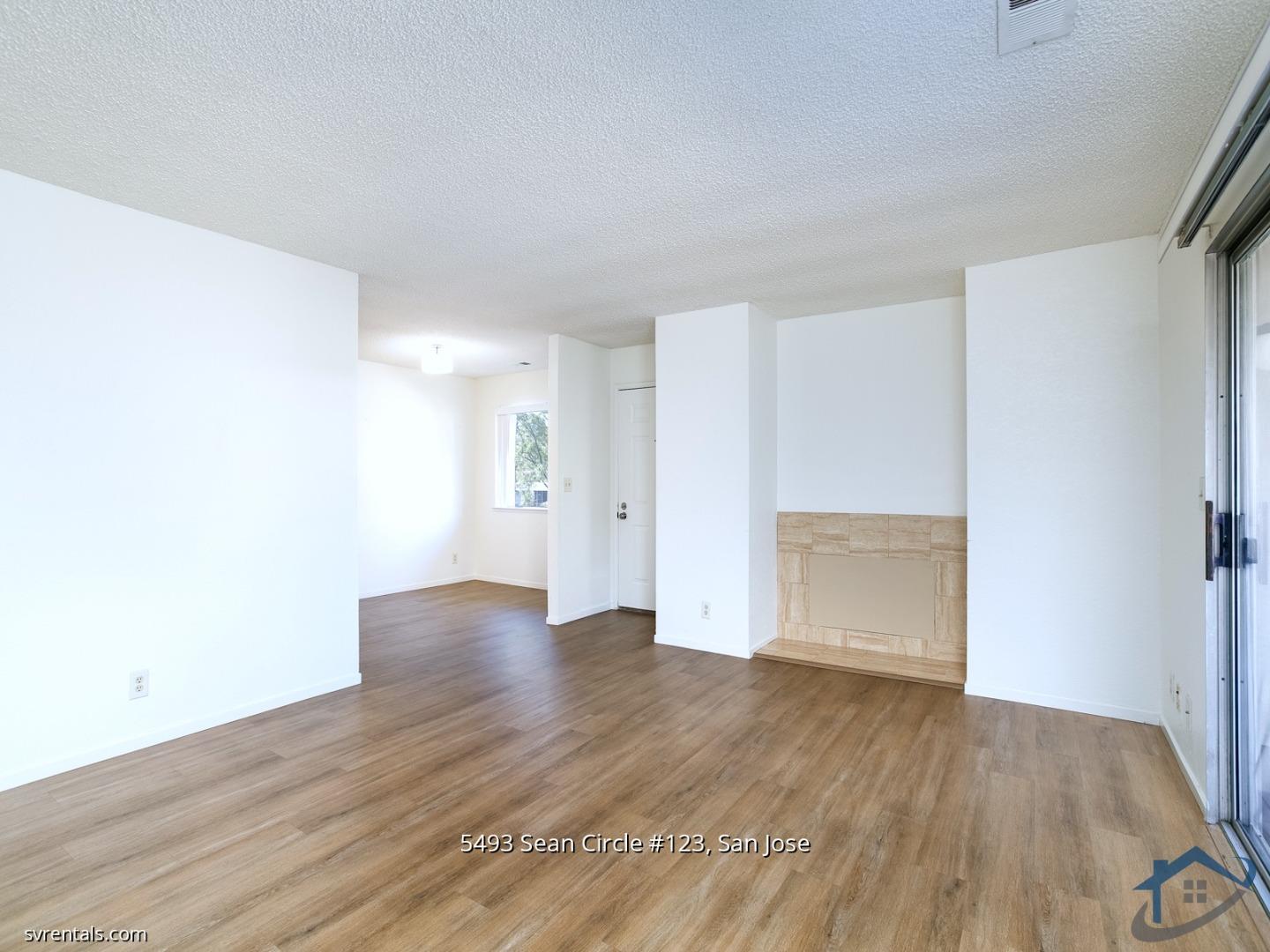 5493 Sean Circle, Unit 123 San Jose, CA 95123 - Photo 3 of 22 a view of an empty room with wooden floor