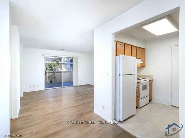 a view of a kitchen cabinets and wooden floor