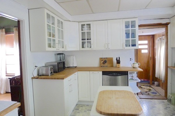 99 Sachem Road Needham, MA 02494 - Photo 3 of 13 a kitchen with a sink and cabinets