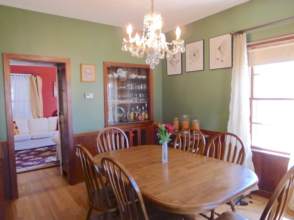 99 Sachem Road Needham, MA 02494 - Photo 6 of 13 a view of a dining room with furniture and chandelier