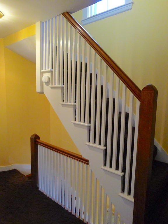 99 Sachem Road Needham, MA 02494 - Photo 9 of 13 a view of staircase with railing and a window