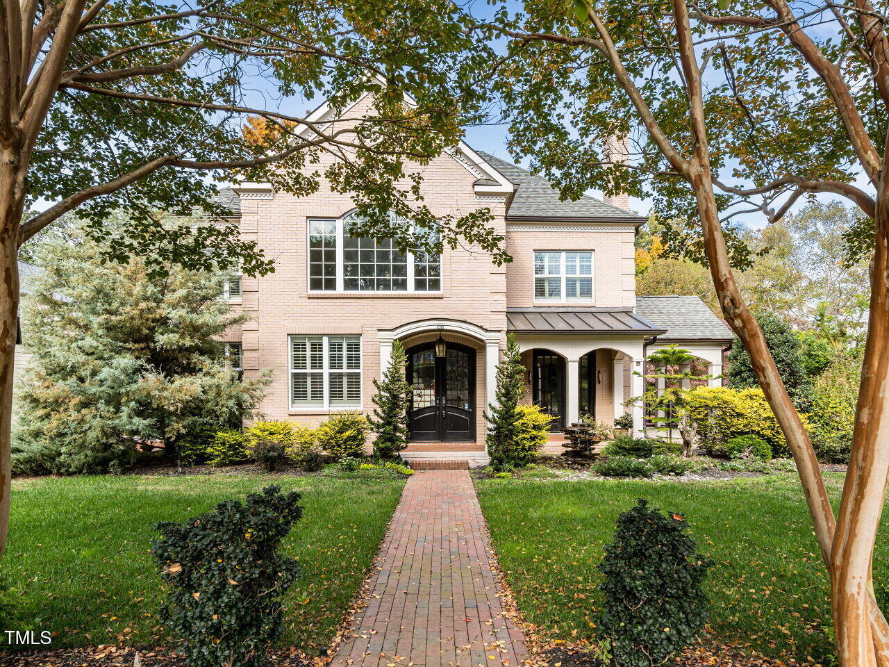 2315 Byrd Street Raleigh, NC 27608 - Photo 1 of 36 a front view of a house with garden and trees