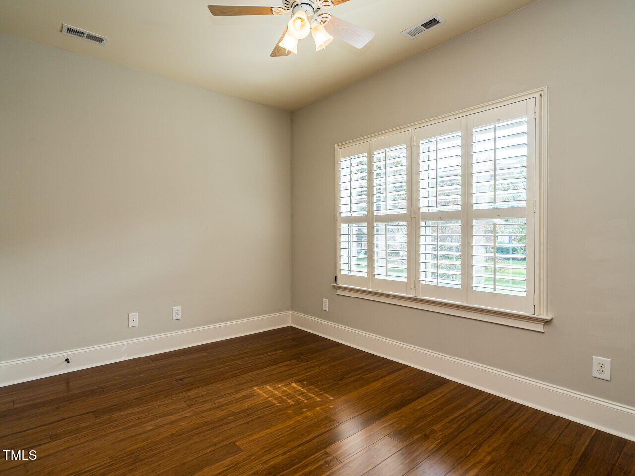 2315 Byrd Street Raleigh, NC 27608 - Photo 23 of 36 an empty room with wooden floor and windows
