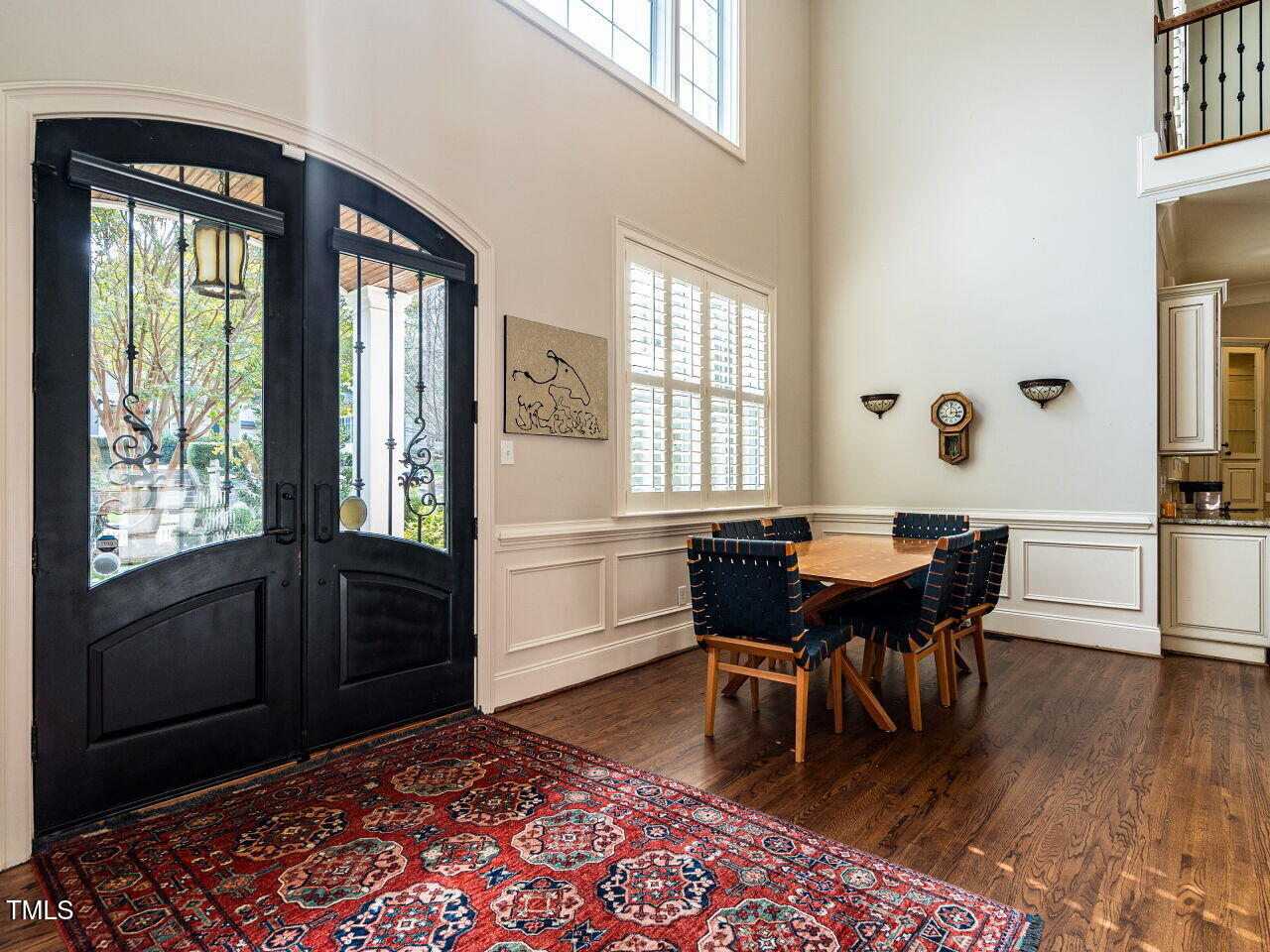 2315 Byrd Street Raleigh, NC 27608 - Photo 8 of 36 a dining room with wooden floor a chandelier a wooden table and chairs
