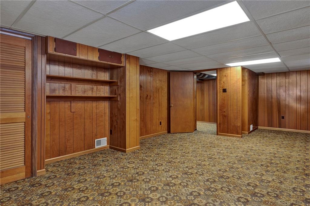 1256 Blaine Road Monaca, PA 15061 - Photo 17 of 23 Large game room with plenty of space, a built in area for your TV or video equipment. Door on the left is the mechanical room.