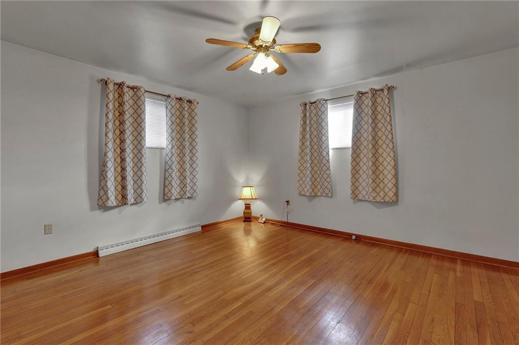1256 Blaine Road Monaca, PA 15061 - Photo 8 of 23 Spacious master bedroom, original hardwood flooring, cedar lined closet and ceiling fan.