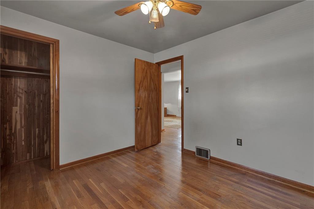 1256 Blaine Road Monaca, PA 15061 - Photo 10 of 23 Bedroom number 2, hardwood floors, cedar lined closet, and ceiling fan.