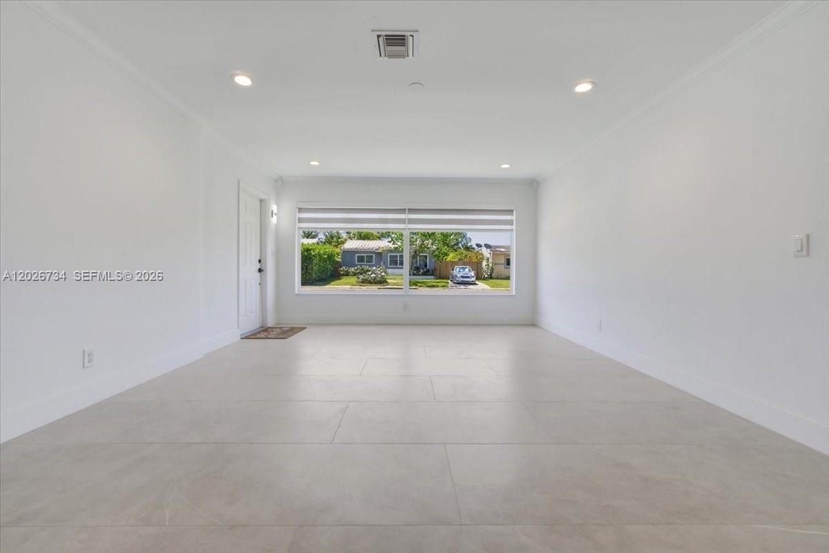 266 Southwest 6th Street Dania Beach, FL 33004 - Photo 7 of 37 wooden floor in an empty room with a window
