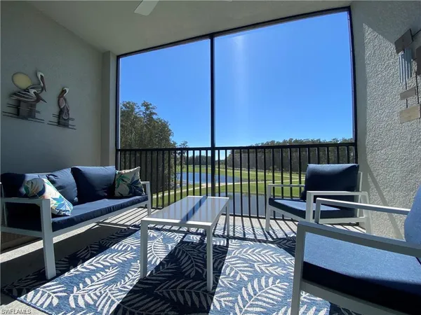 a reading room with furniture window and a lamp