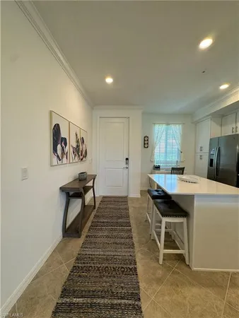 a kitchen that has a table and chairs in it